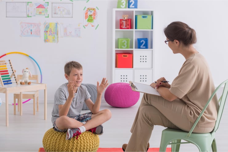 child-sits-stool-with-sign-that-says-number-2-it