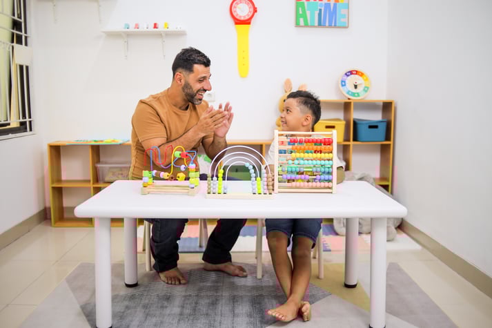 father-appreciating-son-his-calculate-with-abacus